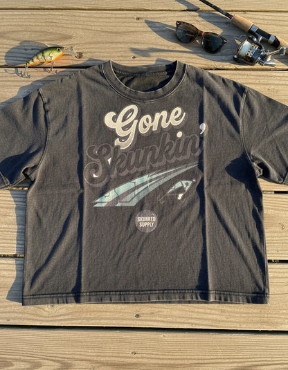 Gone Skunkin' tee on the dock with fishing gear