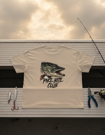 Pike Bite Club tee on the dock with fishing gear