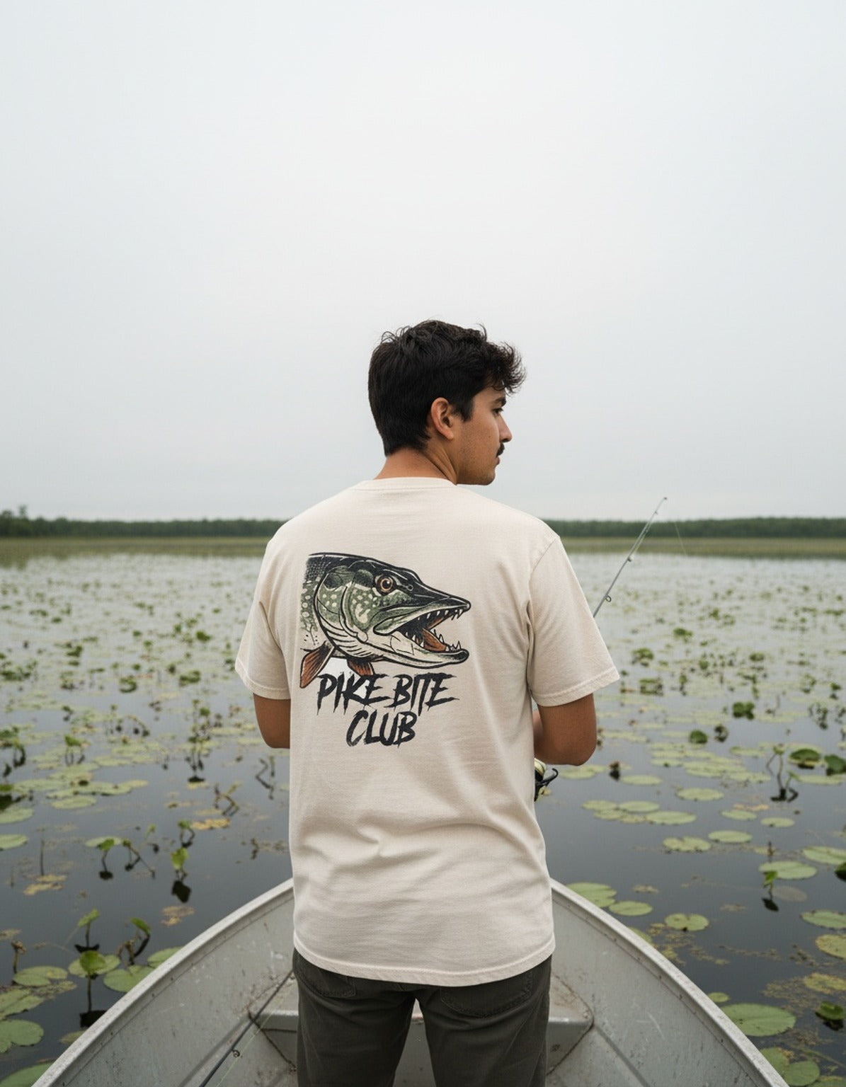 Pike Bite Club tee worn by an angler at the lake
